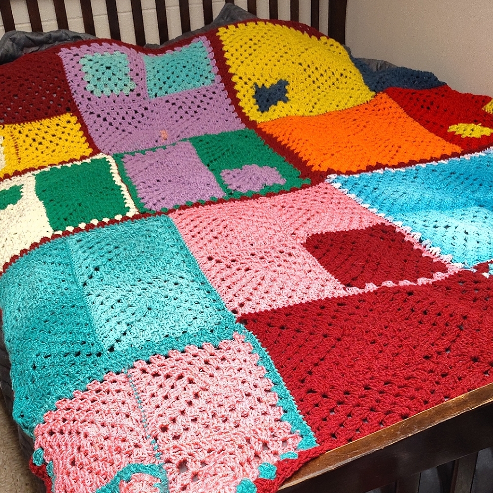 Red and Yellow Crochet Blanket with Intricate Patterns